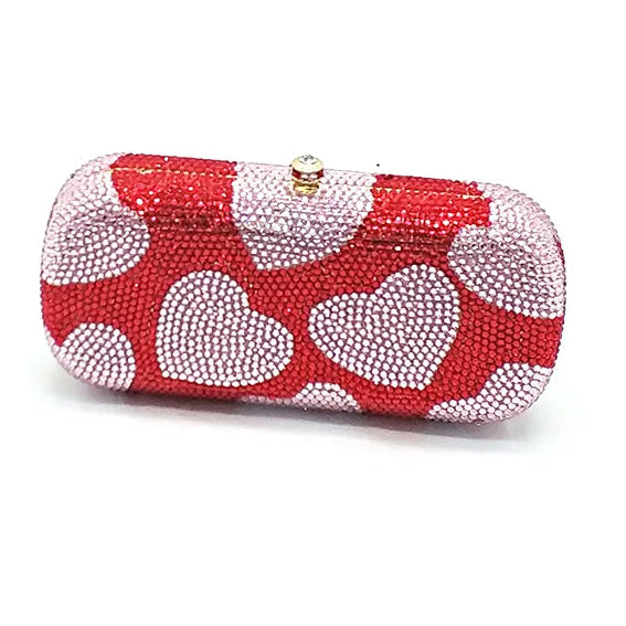 Red clutch bag with white heart patterns on a white background