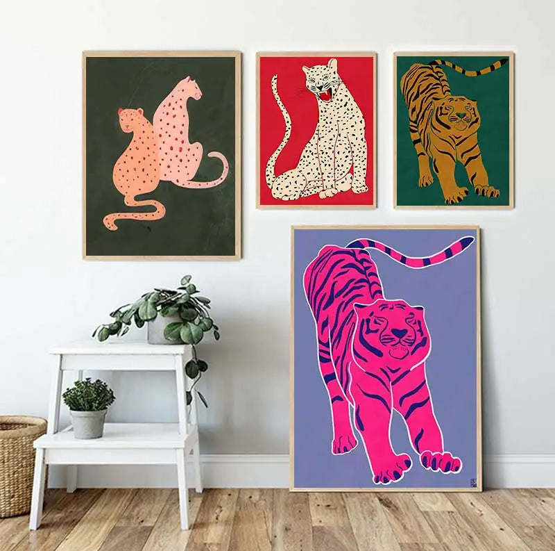 Four colorful animal posters on a wall with a small table and plants below.