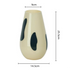 Beige vase with black spots and measurements on a white background