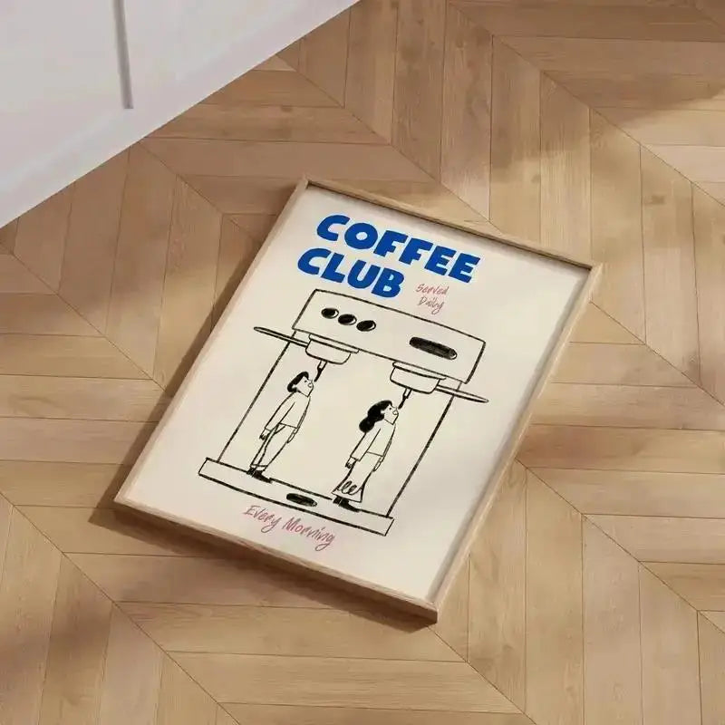 Framed poster with 'Coffee Club' design on a wooden floor.
