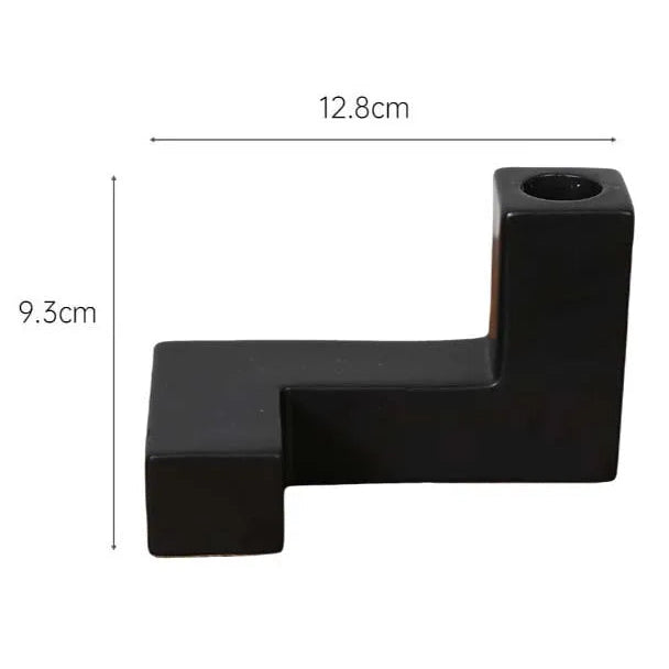 Black candle holder with dimensions labeled on a white background