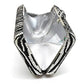Silver clutch with black and white patterned strap on a white background
