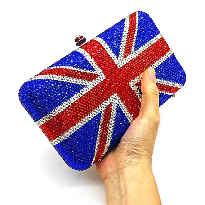 Hand holding a clutch bag with Union Jack design on a white background