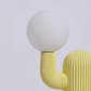 Modern lamp with a white shade and yellow base on a light gray background