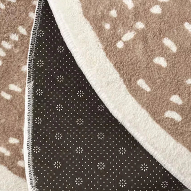 Close-up of a rug with brown, white, and black patterns
