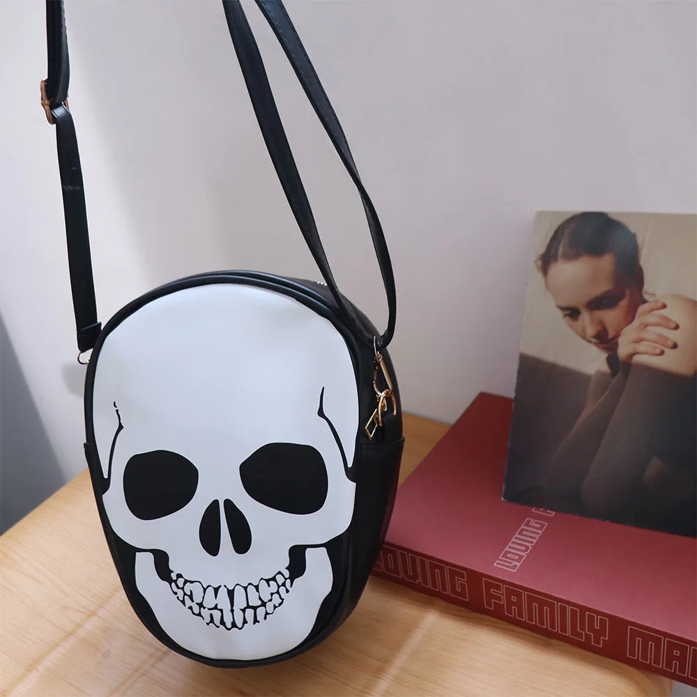 Skull-shaped bag on a wooden surface with a book in the background