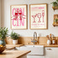 Modern kitchen with wooden countertops, white cabinets, and decorative wall art.