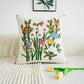 Decorative pillow with floral embroidery on a white couch