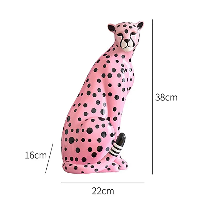 Pink cheetah figurine with measurements on a white background