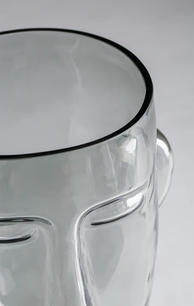 Clear glass container with a smooth, transparent surface on a gray background