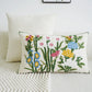 Decorative pillow with floral pattern on a white couch