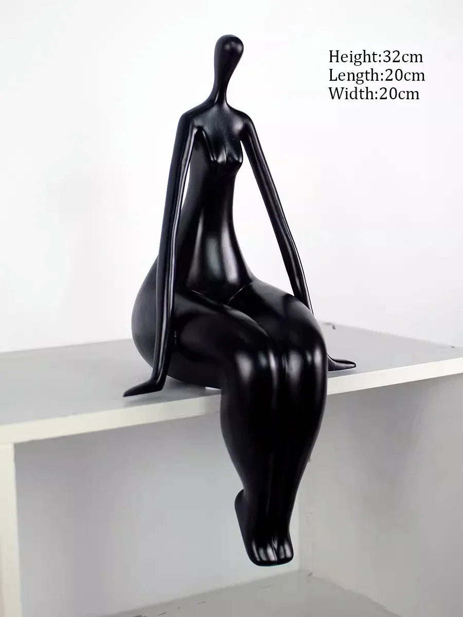 Black abstract sculpture on a white surface with dimensions displayed.