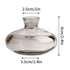 Clear glass vase with measurements on a white background