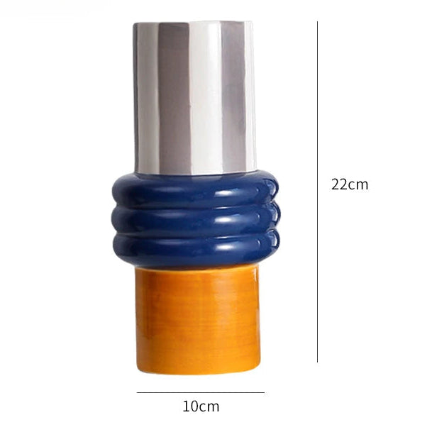 Multicolored cylindrical object with measurements on a white background