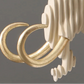Decorative chandelier with gold and white design on a gray background