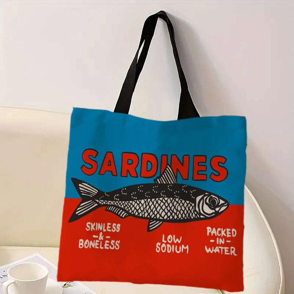 Tote bag with sardine design on a white surface