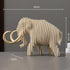 Wooden mammoth model with measurements on a gray background