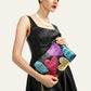 Woman holding a colorful heart-shaped clutch with 'CEZIRA' branding.