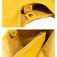 Close-up of a yellow bag with visible stitching and hardware, branded 'MABULA'.