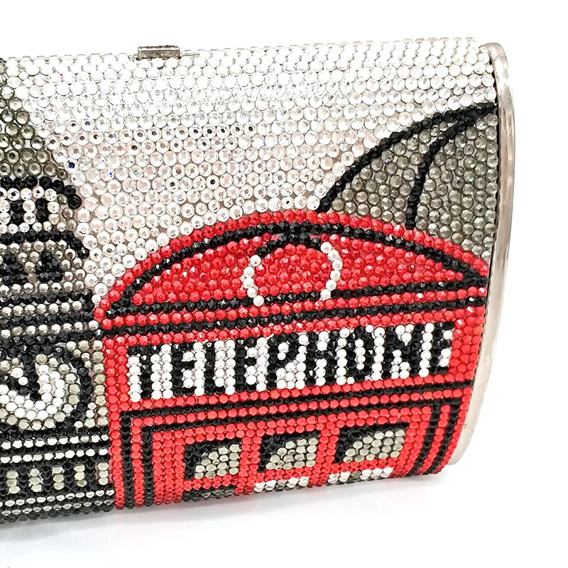 Clutch bag with a red telephone box design and 'HELLO' text, featuring crystals.