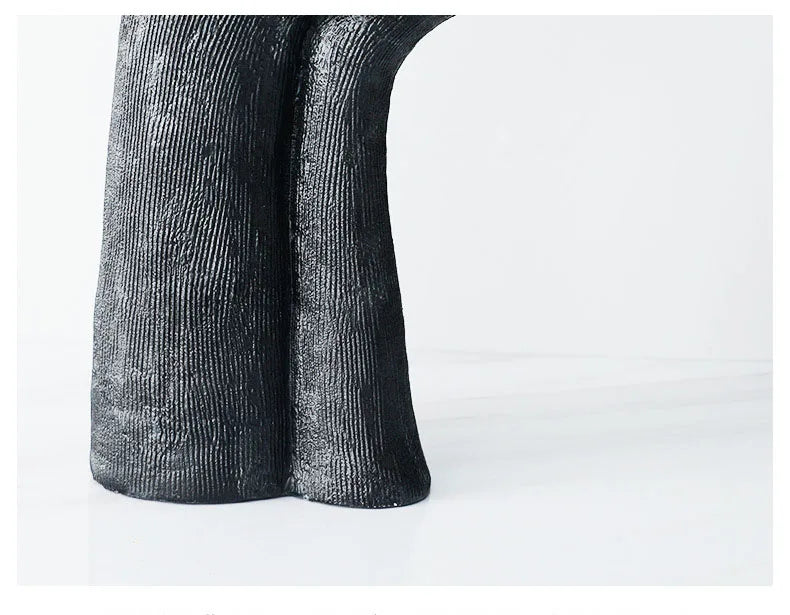 black sleeping figure resin sculpture styled product view