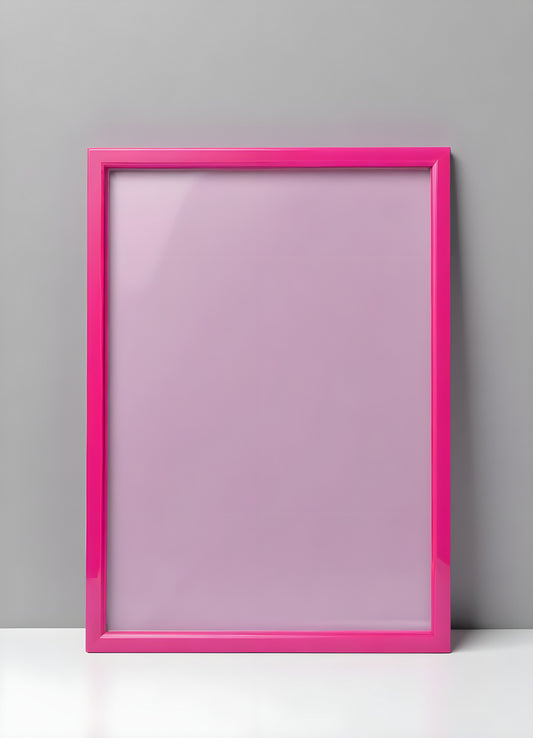 Bright pink empty frame stands against a white wall, inviting creativity and personal expression