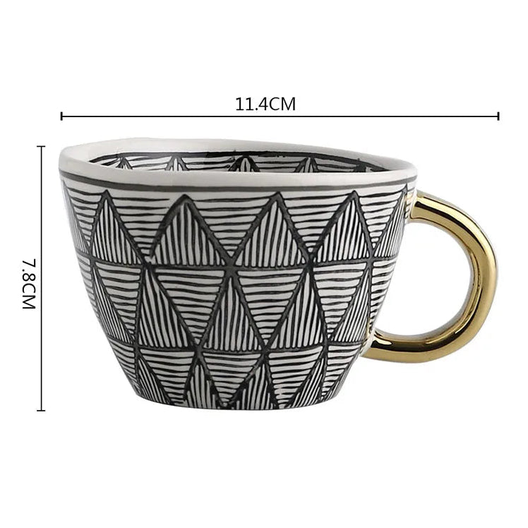 Ceramic mug with geometric pattern and gold handle, shown with measurements on a white background