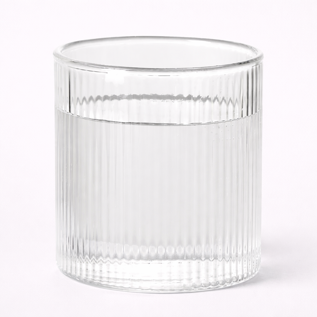 Clear glass with ribbed design on a white background