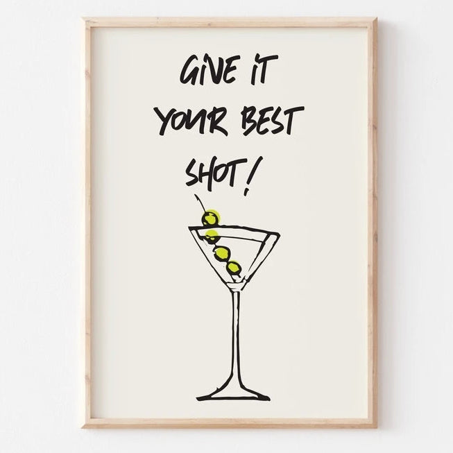 Framed print with a martini glass and 'Give it your best shot!' text on a white background