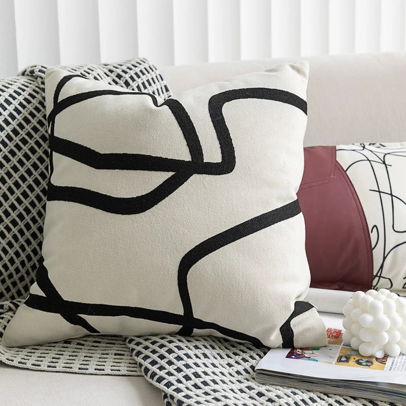 Modern cream square pillow cover with black graphic line design