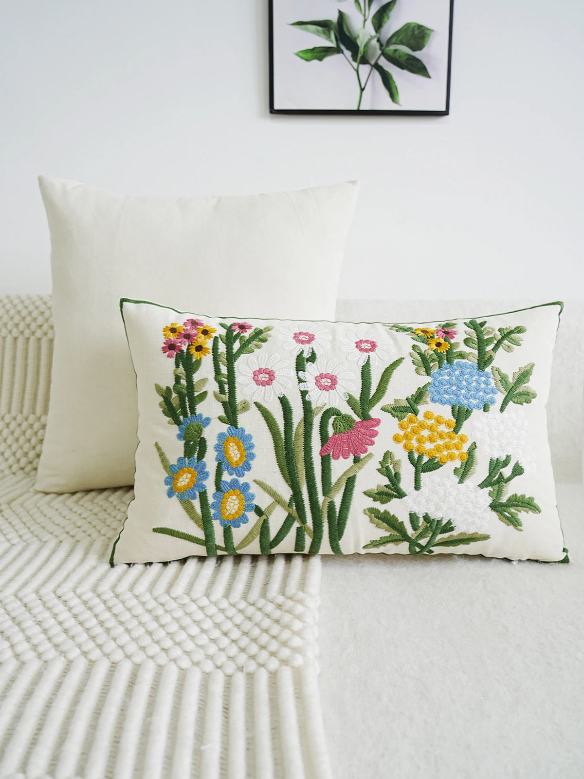 Decorative pillow with floral pattern on a white couch
