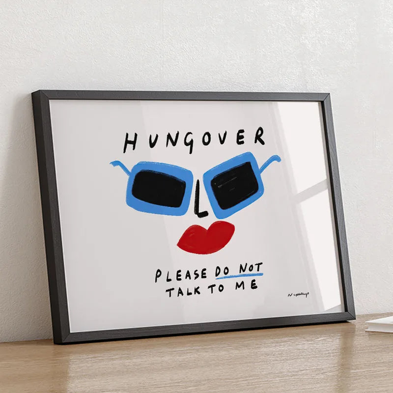 Framed artwork with sunglasses and text on a white background