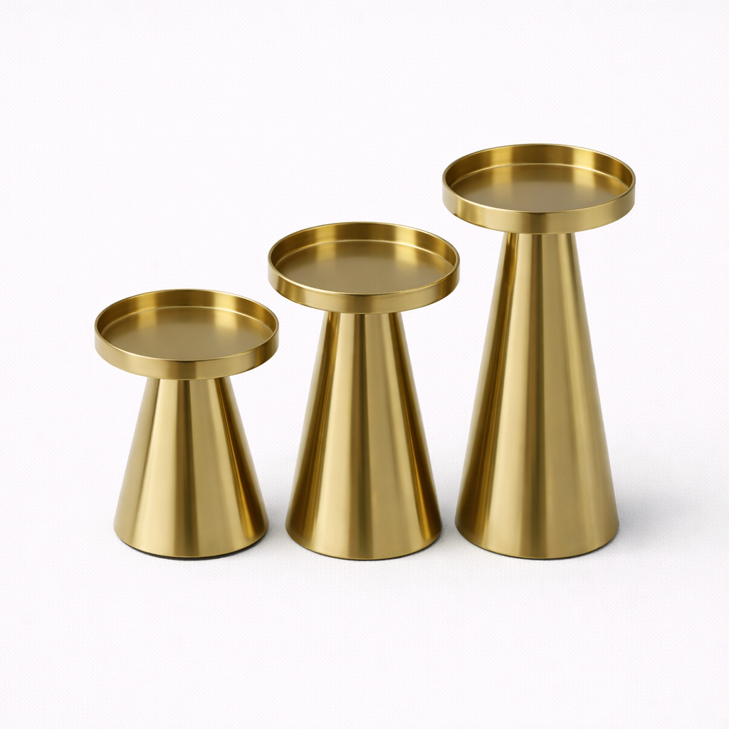 Set of three gold metal candle holders in graduated heights