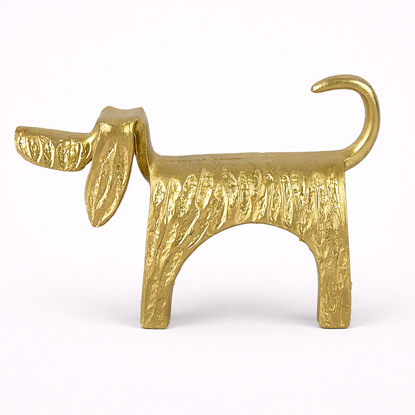 Gold dog-shaped object on a white background