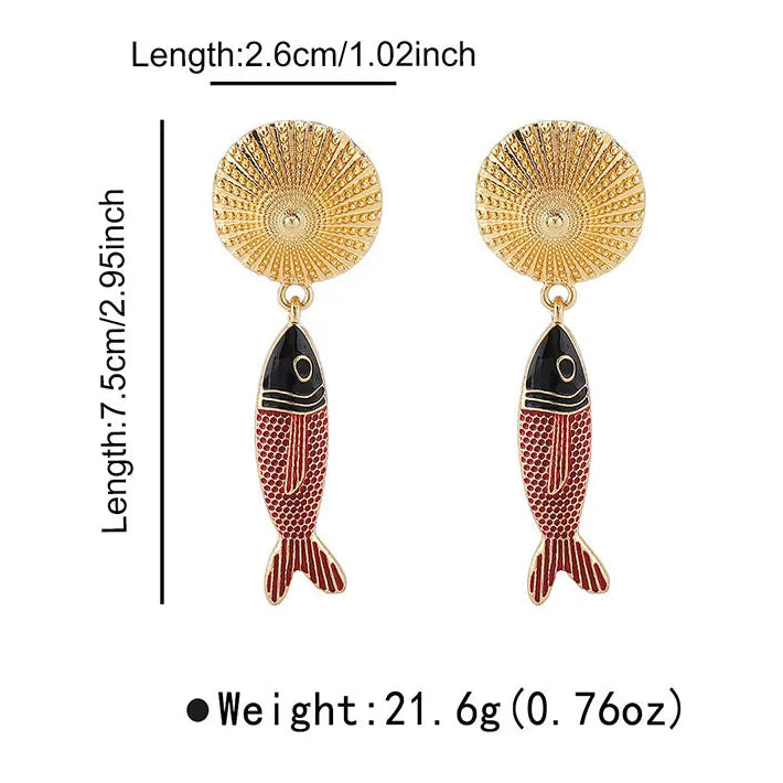 Gold and red fish-shaped earrings with measurements on a white background
