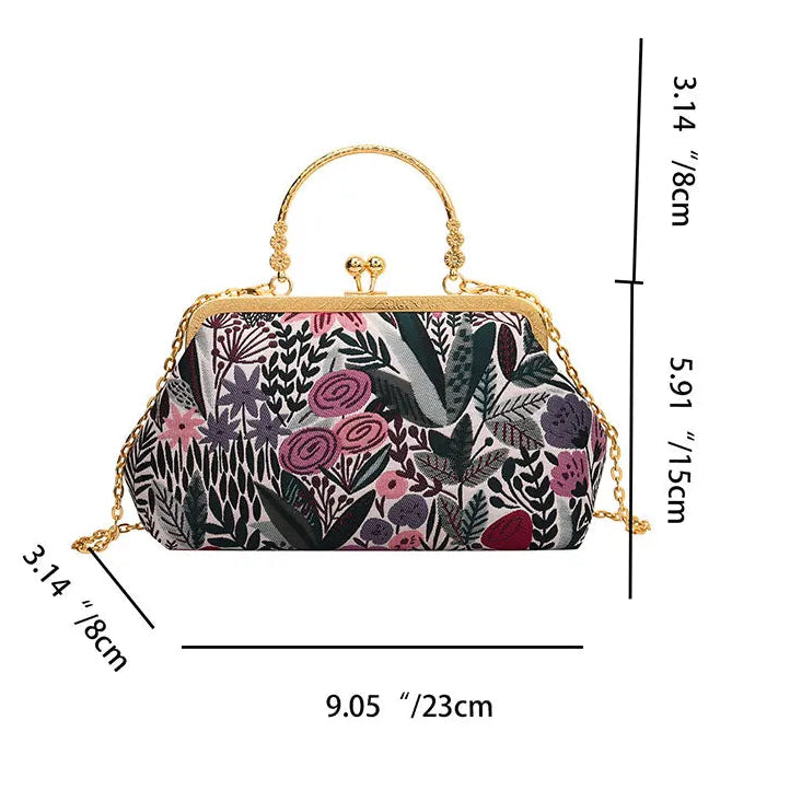 Floral patterned handbag with gold accents and dimensions on a white background