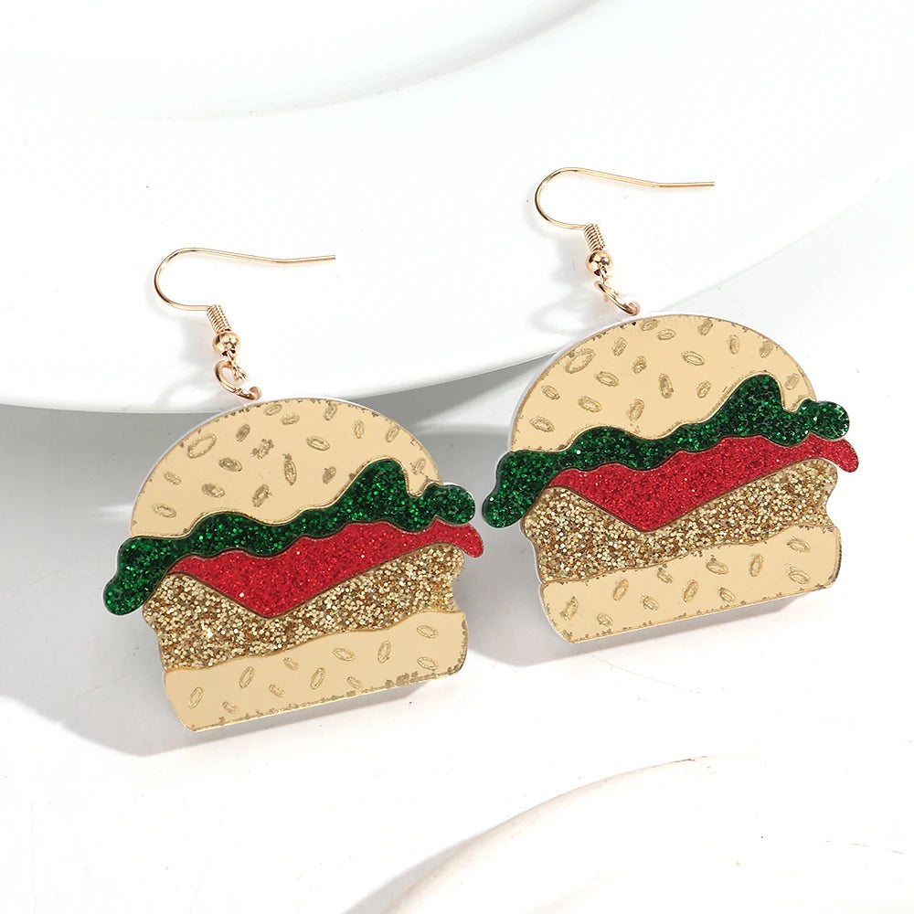 Burger-shaped earrings on a white background