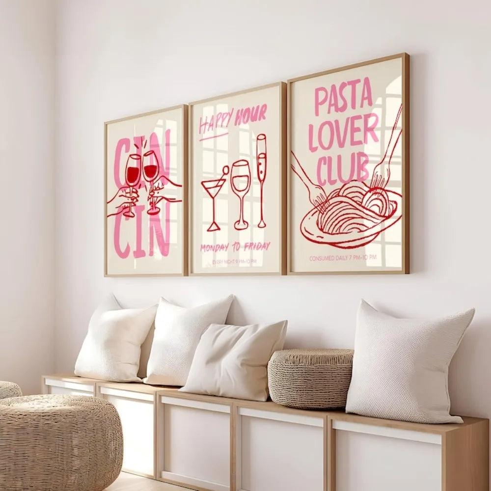 Three framed prints on a wall above a sofa with decorative pillows and a woven basket.