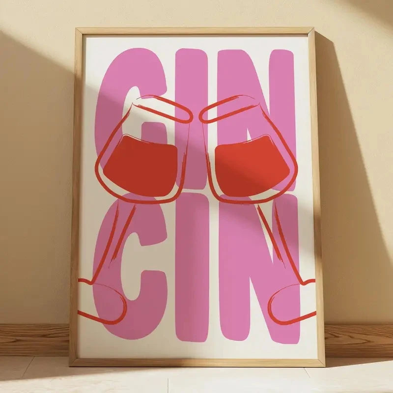 Framed artwork with 'GIN' text and red glasses on a beige background