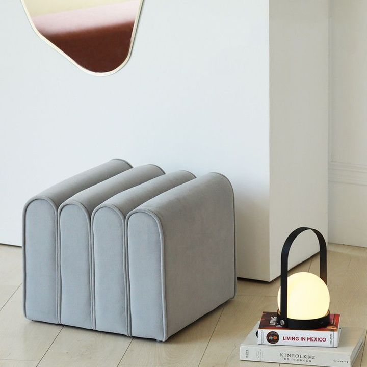 Light grey curved ottoman contemporary home accent
