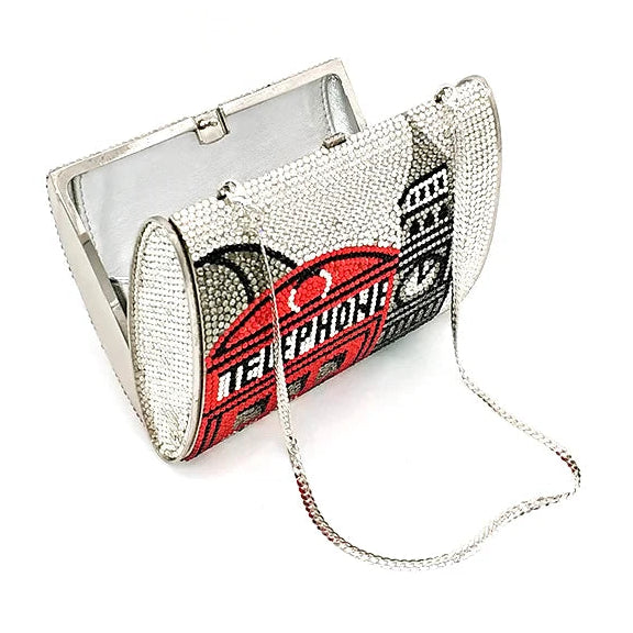 Designer handbag with chain strap on a white background