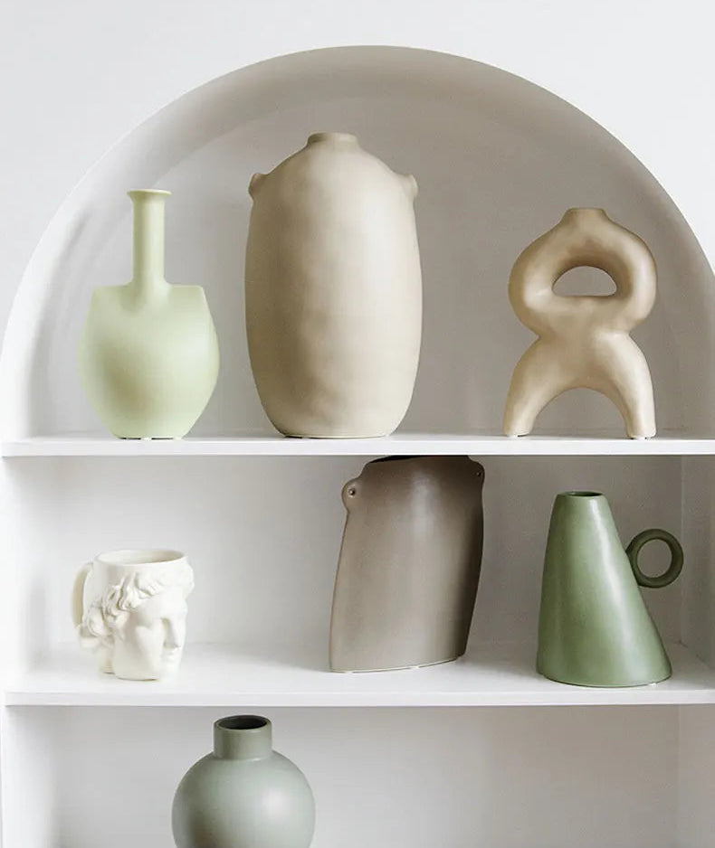 sage green ceramic vase circular handle 17 5cm styled product view