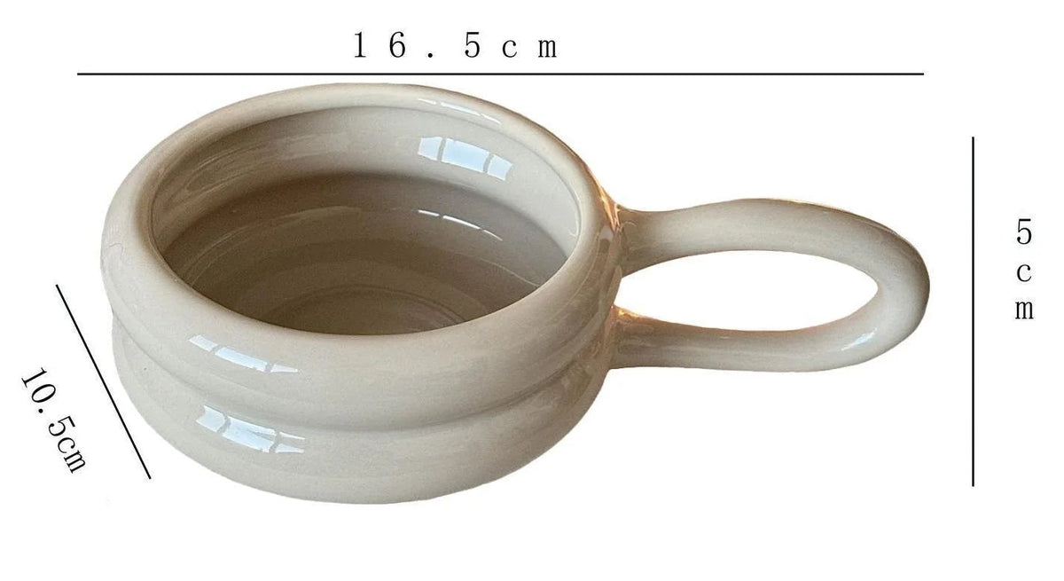 Ceramic measuring cup with dimensions and capacity details on a white background