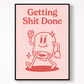 Framed poster with a cartoon character and text 'Getting Shit Done' on a pink background