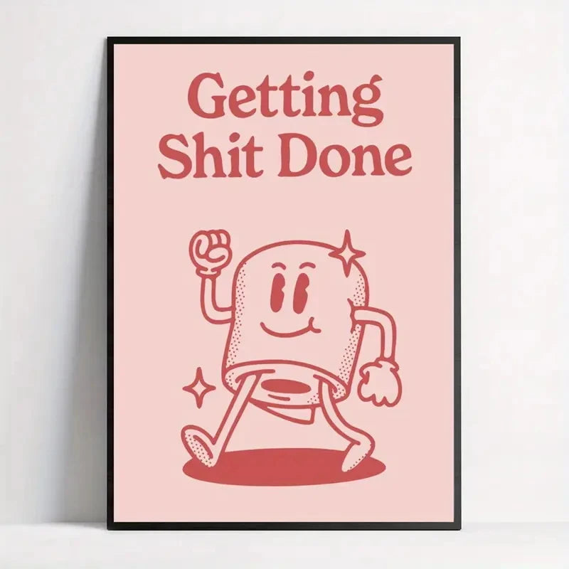 Framed poster with a cartoon character and text 'Getting Shit Done' on a pink background