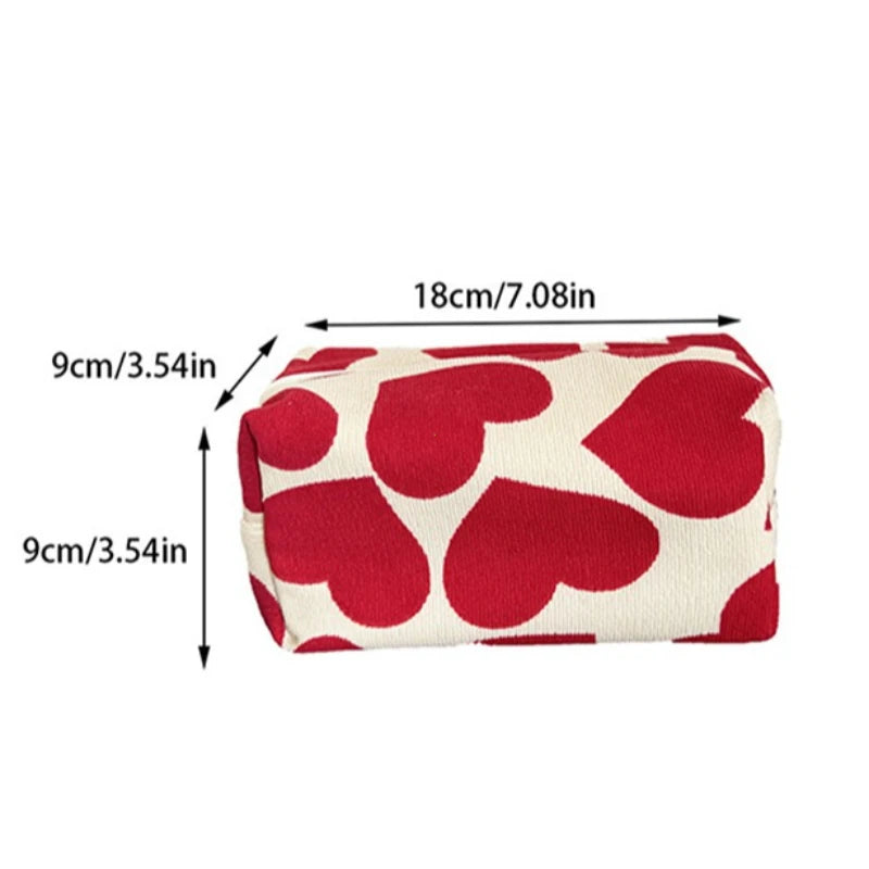 Red heart-patterned pouch with measurements on a white background